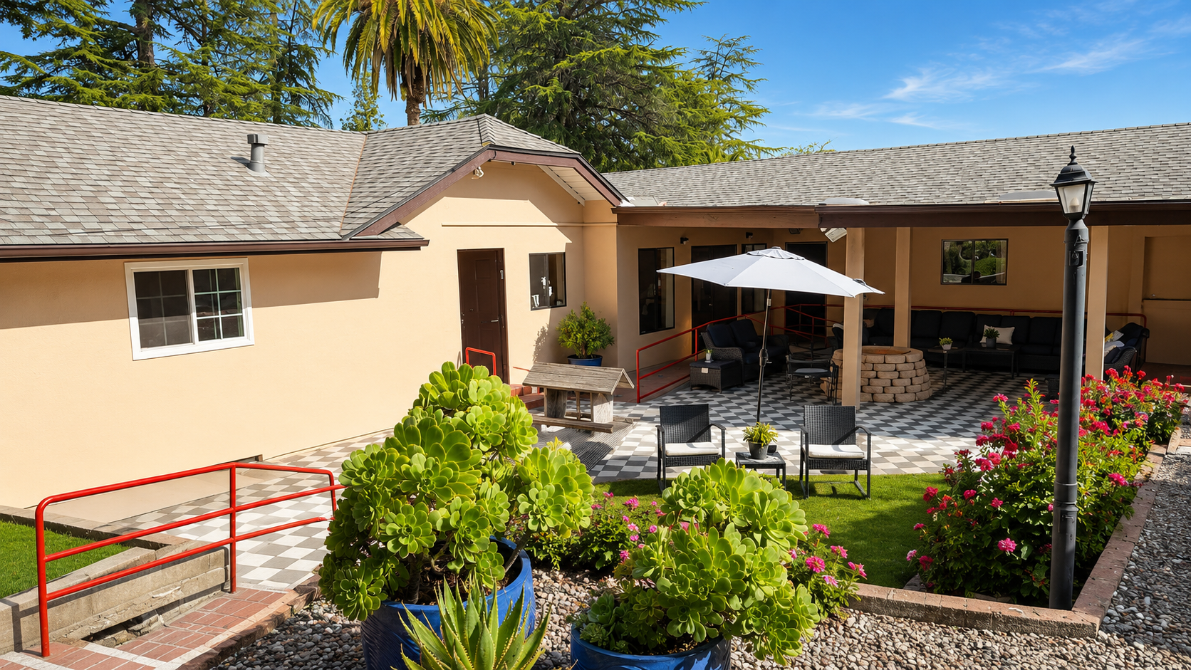The garden and front porch of North Lake Villas at golden hour.